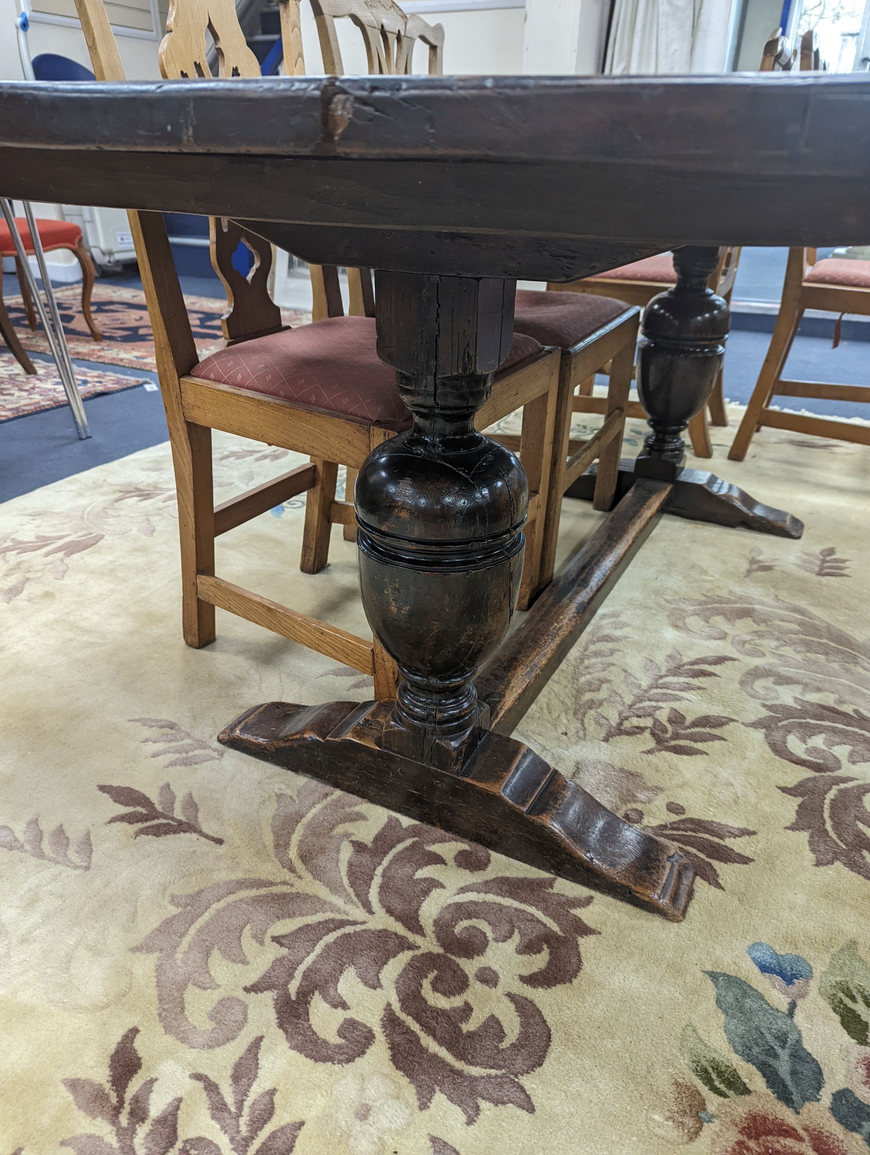 A 17th century style rectangular oak refectory dining table. Length -183cm, Width-91cm, Height-74cm.